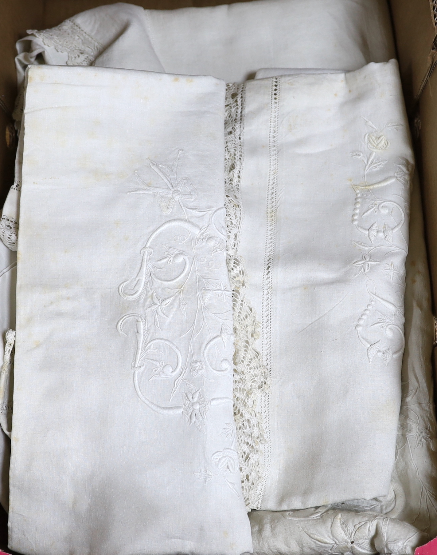 A monogrammed and embroidered lace edged French provincial linen sheet and pillowcase set (3), together with another lace inserted sheet and two plain pillowcases